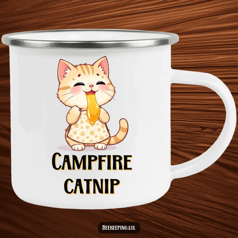 Funny playful cat wearing a patterned apron, tasting honey, a sturdy and humorous enamel camping mug.