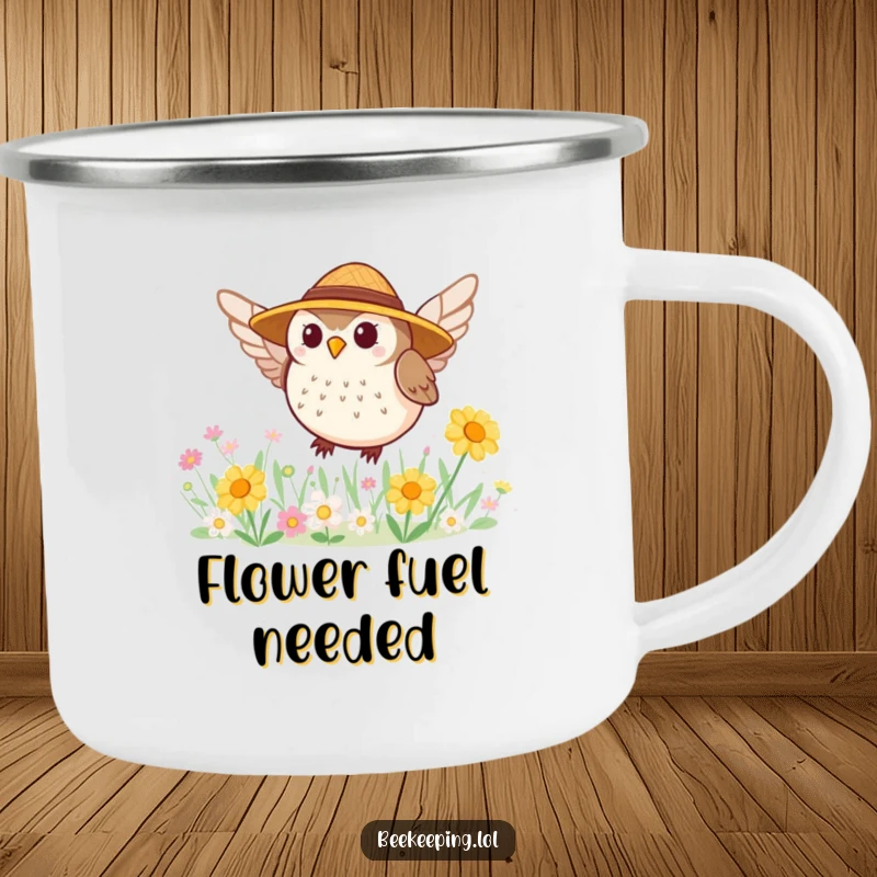 Funny camping mug with a tiny, round owl in a straw hat buzzing around a flower patch, for outdoor enjoyment.