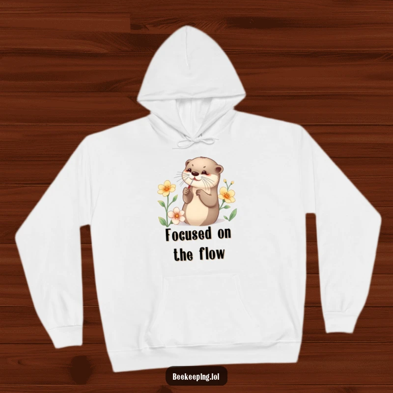 Funny Otter Hoodie featuring a graceful otter collecting nectar with a small tool, a cozy and comical representation of meticulous effort.