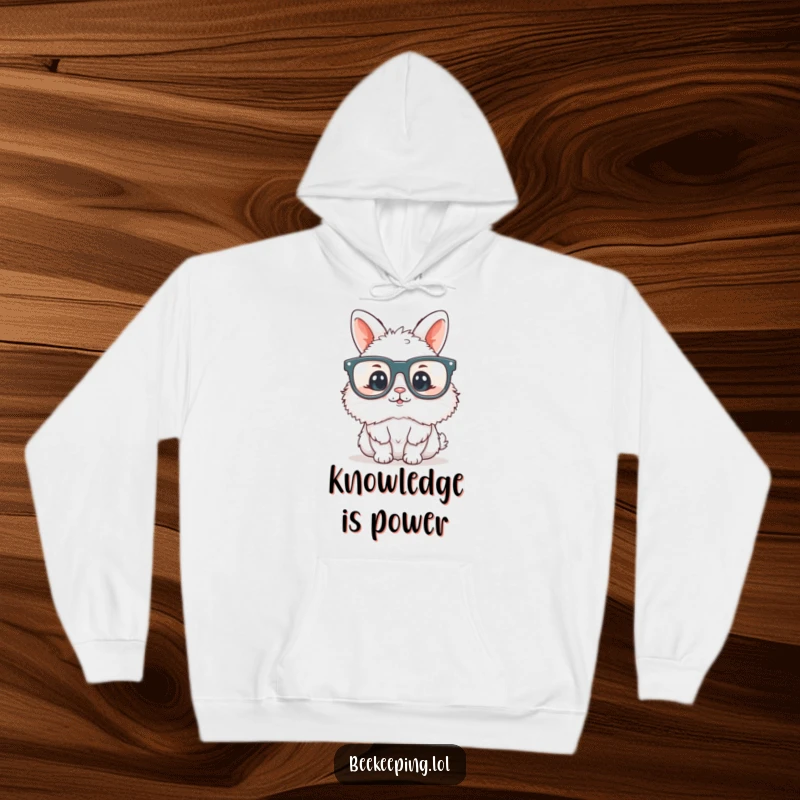 Funny fluffy bunny wearing oversized reading glasses, looking wise and cuddly, featured on a warm hoodie, ideal for readers.