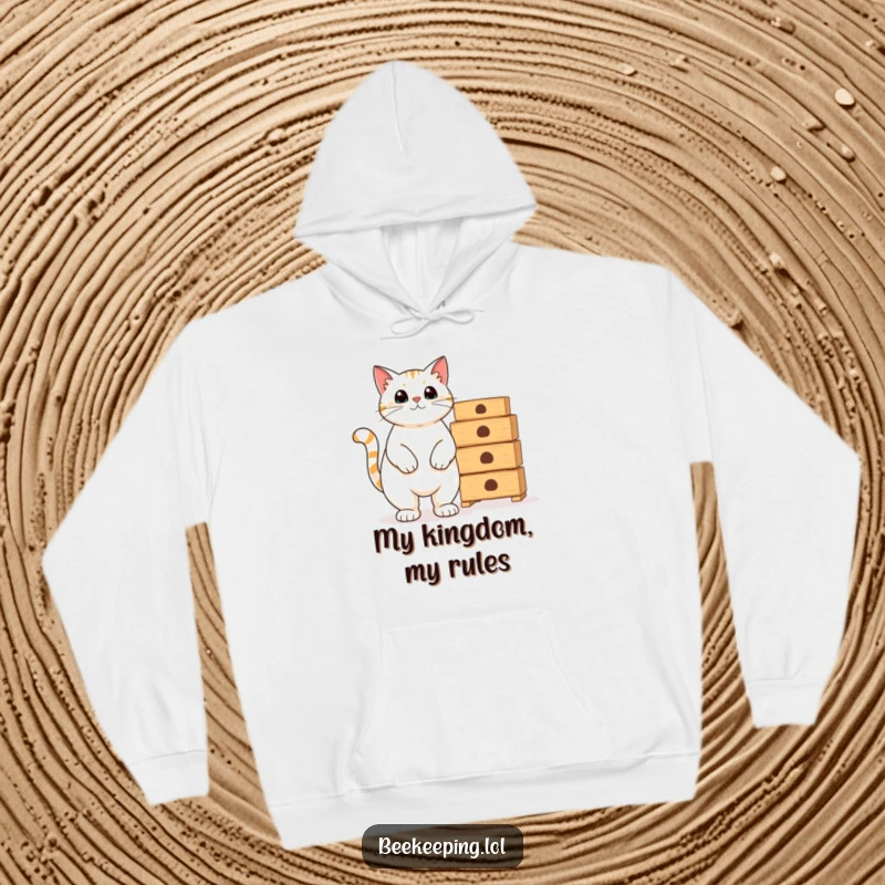 Funny proud cat beside empty beekeeping hives on a cozy hoodie, perfect for humorous warmth.