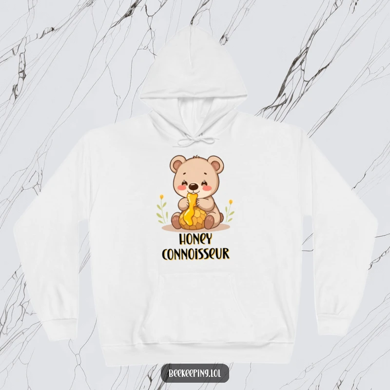 Funny smiling bear cub gently collecting honey from a dripping comb, a warm and humorous hooded sweatshirt.