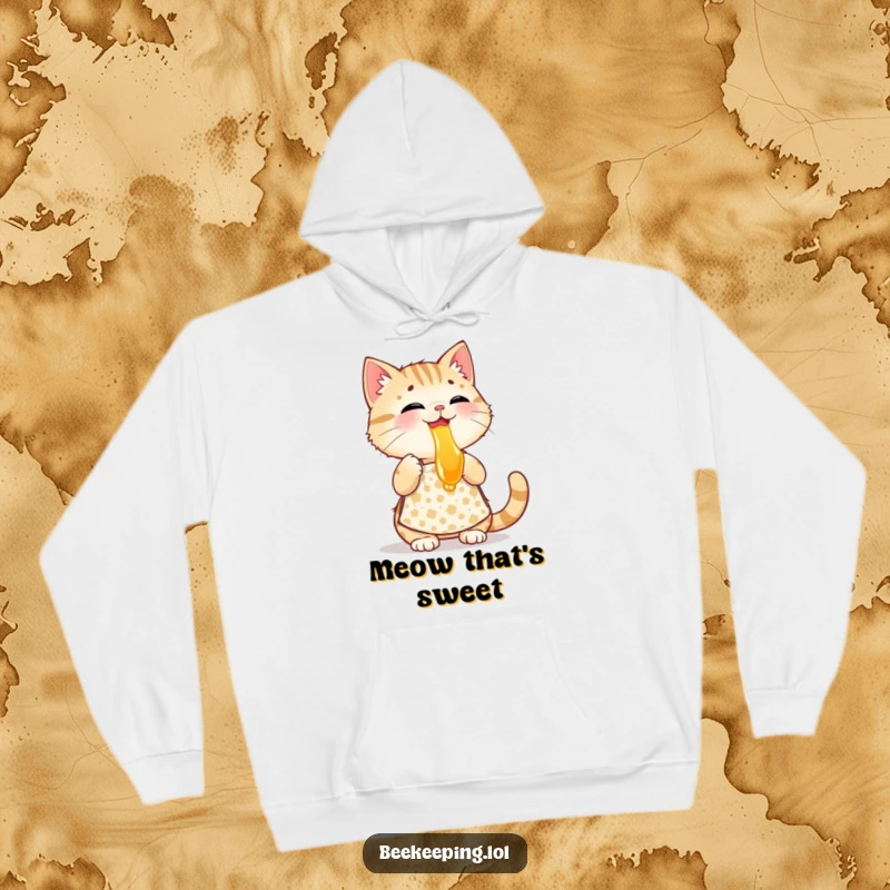 Funny playful cat wearing a patterned apron, tasting honey, a warm and humorous hooded sweatshirt.