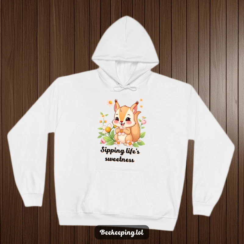 Funny hoodie with a smiling squirrel actively collecting nectar from a flower, offering a cozy and humorous design.