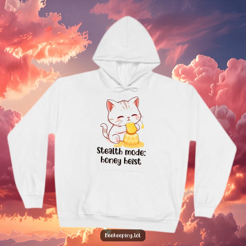 Funny hoodie depicting a determined cat gently collecting honey from a radiant, glowing honeycomb.