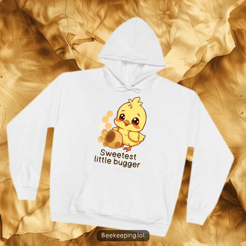 Funny hoodie with a cheerful chick intently pecking at a honeycomb, wide curious eyes full of wonder.