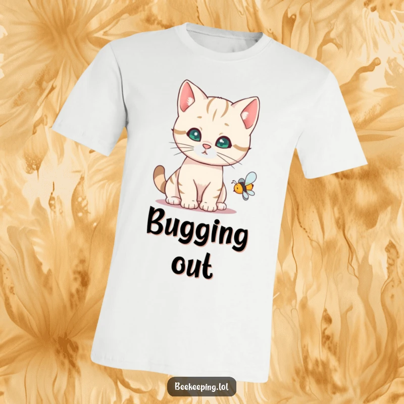 Funny cat t-shirt showing a curious cat examining a buzzing bee, capturing a moment of playful investigation.