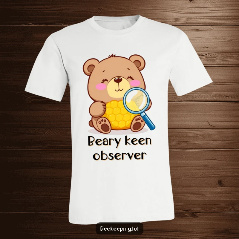 Funny bear with magnifying glass inspecting honeycomb on a t-shirt, detailed art, great humorous gift.