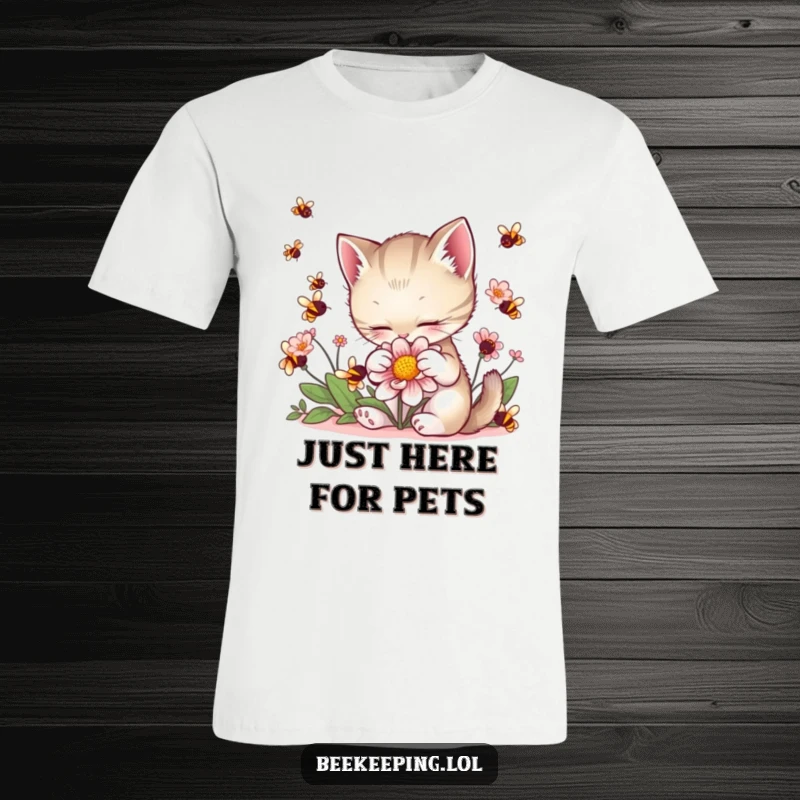 Funny Kitten Flower T-Shirt: A soft kitten gently touches a flower, bees buzzing nearby, showcasing a sweet moment.