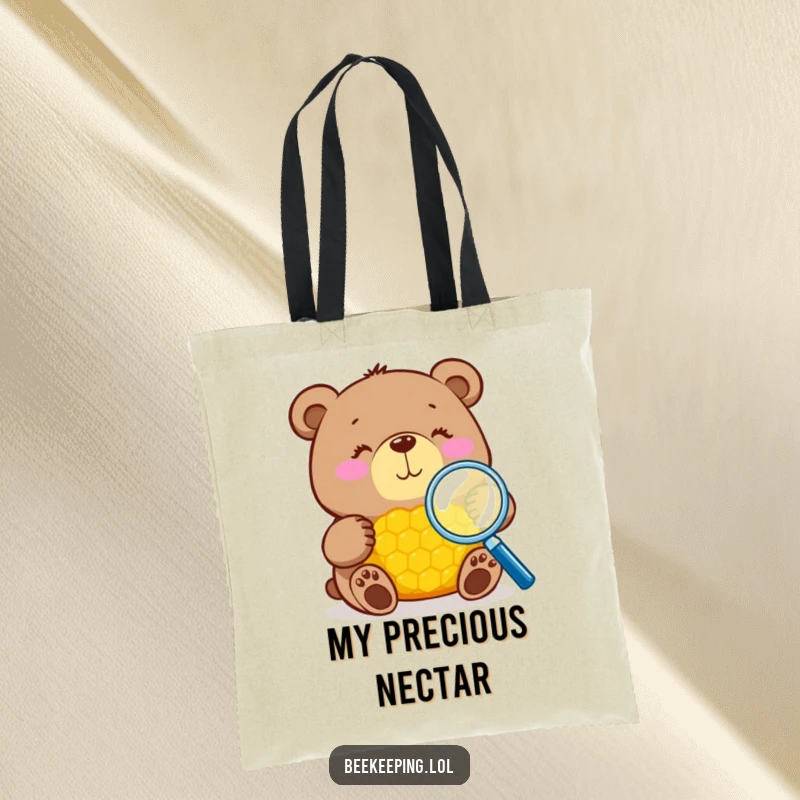 Funny bear with magnifying glass inspecting honeycomb on a tote bag, durable and stylish, ideal funny gift.