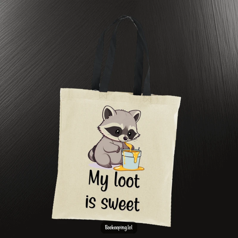 Funny Raccoon Honey Tote Bag, practical and stylish, a determined raccoon gently scooping honey into a small pail, humorous woodland accessory.